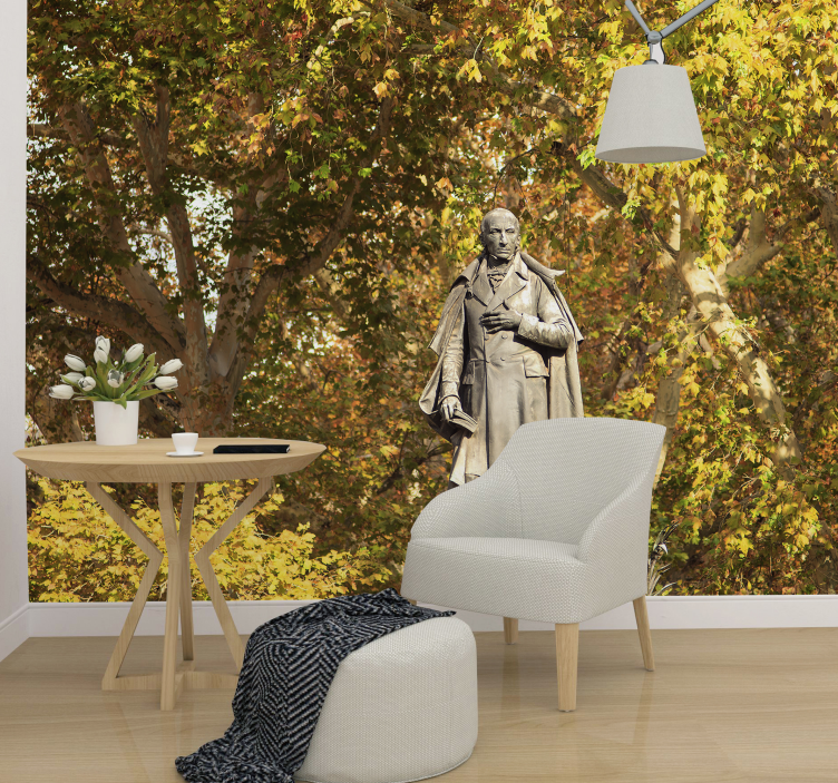 Fototapete Menschen statue zwischen laub - TenStickers